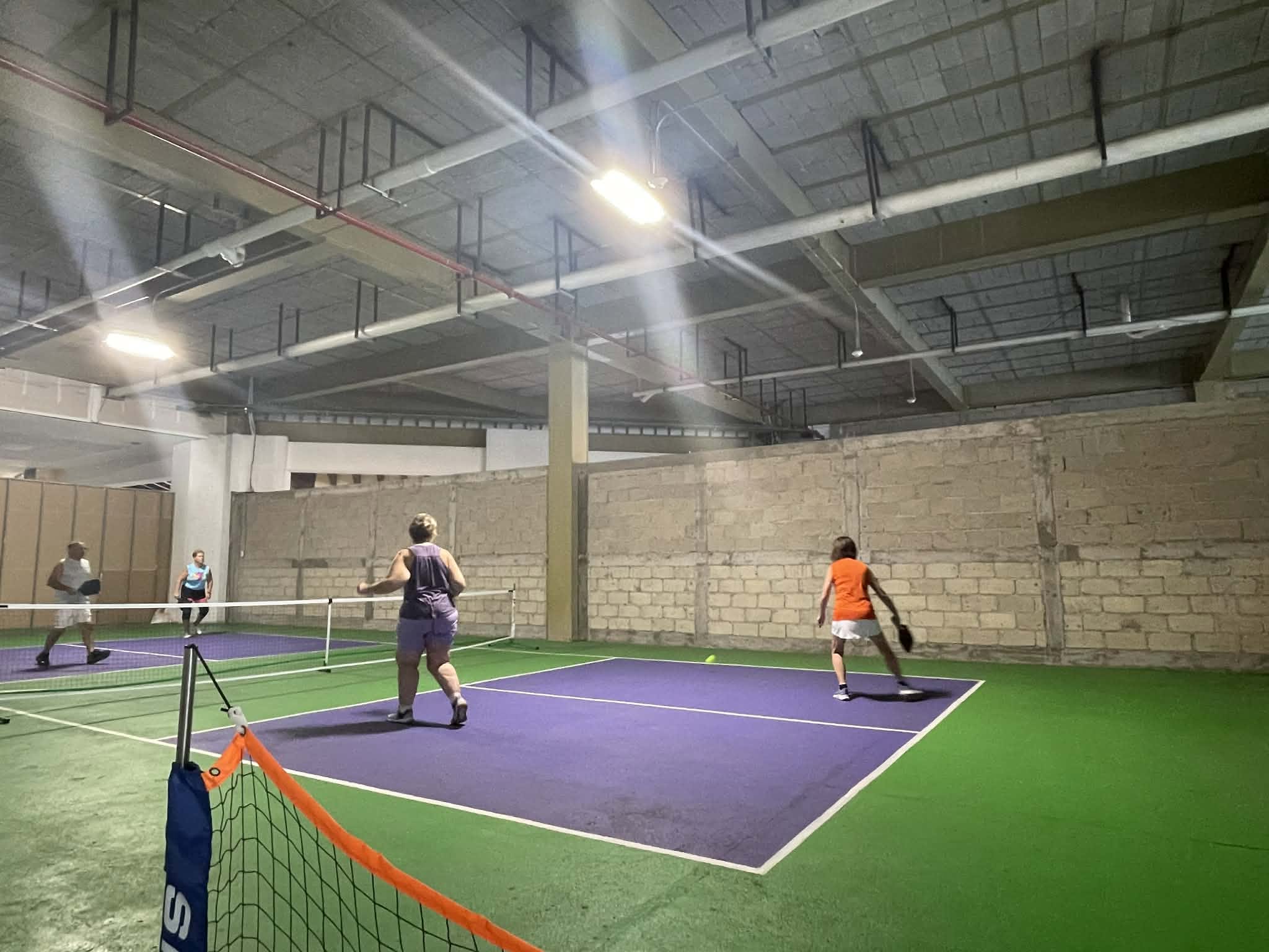 Wide view of the covered pickleball courts at Puerto Mágico